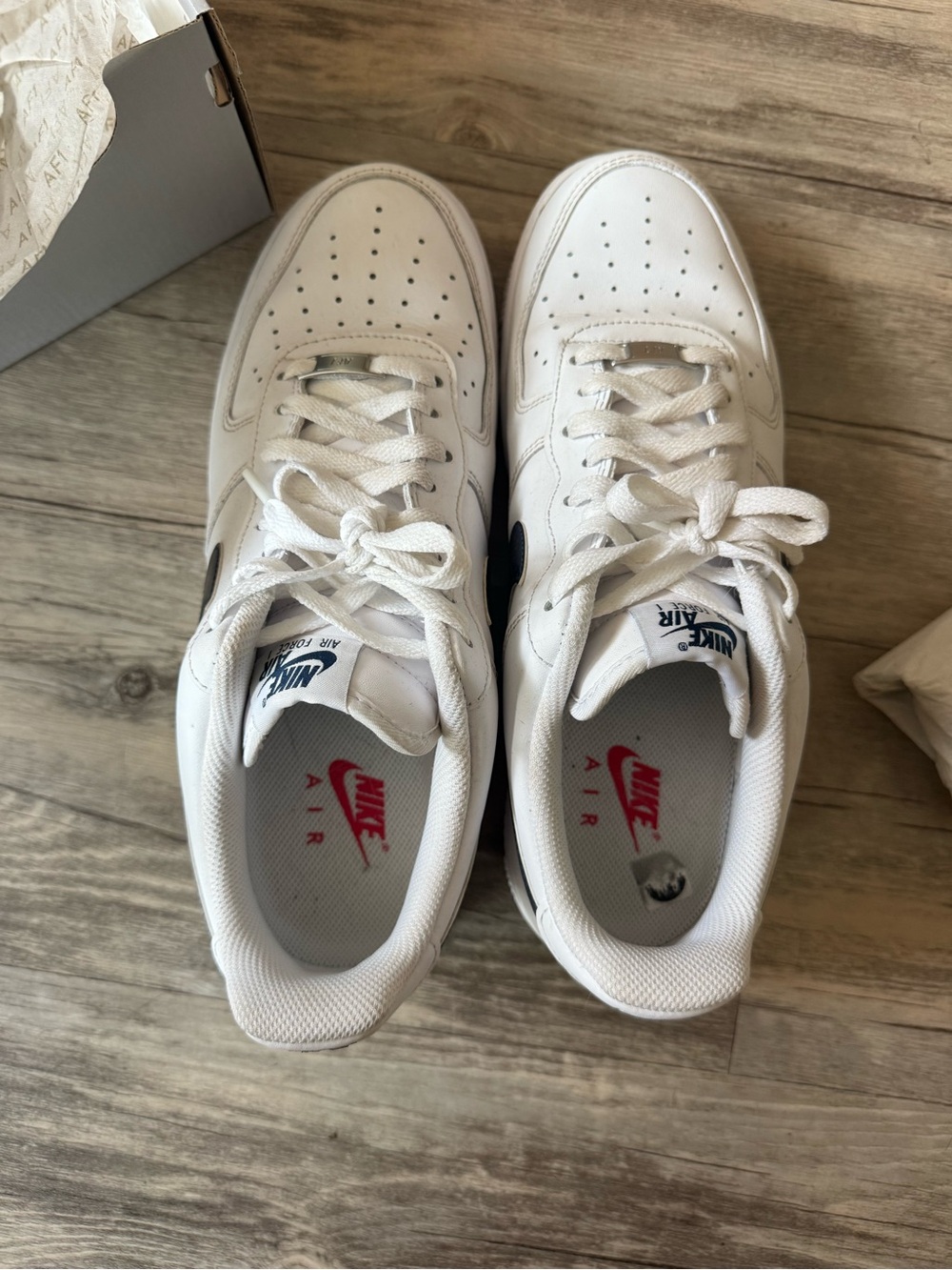 Nike White Sneakers with dark blue Swoosh